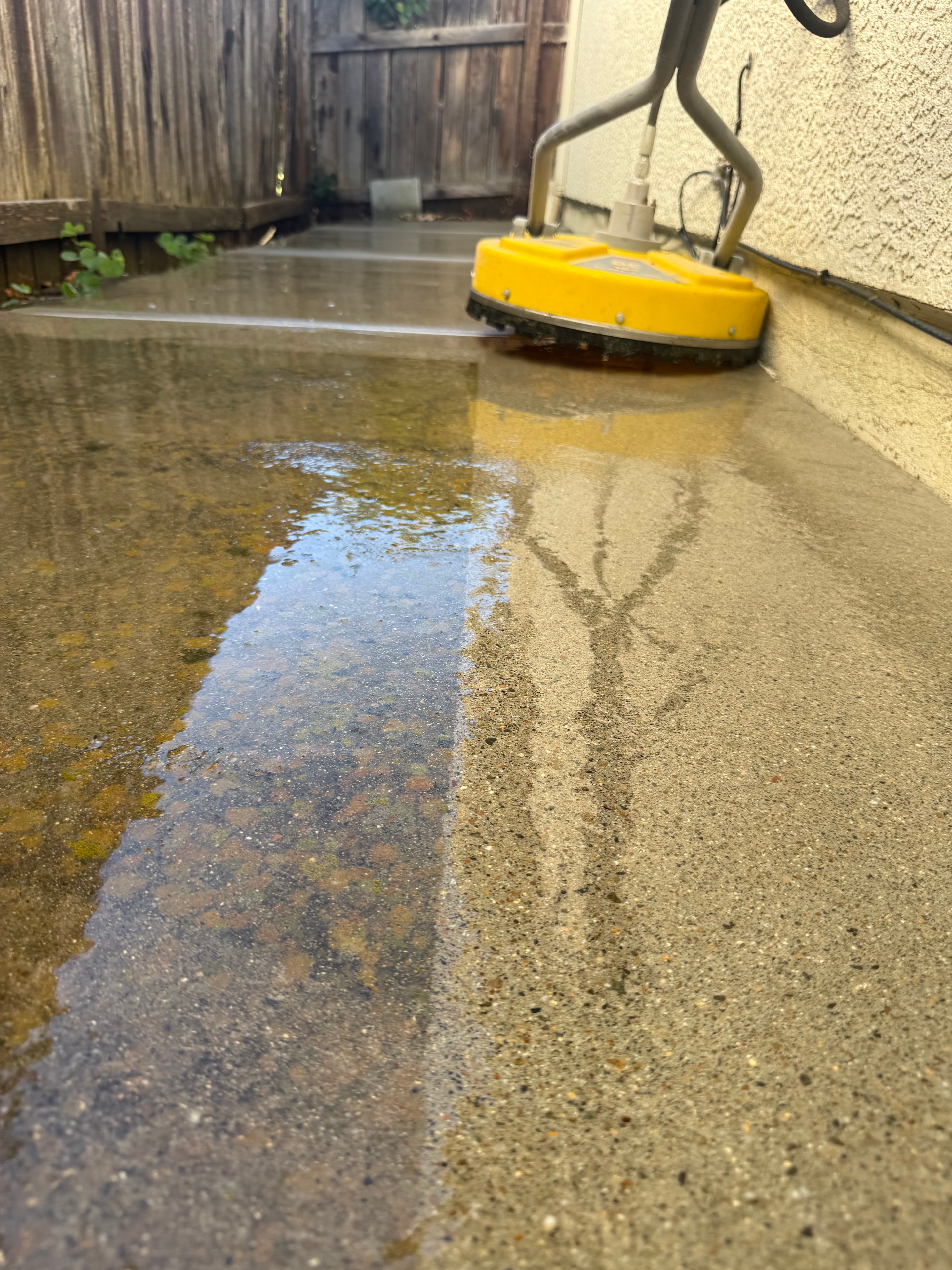 Surface cleaner restoring a residential concrete patio