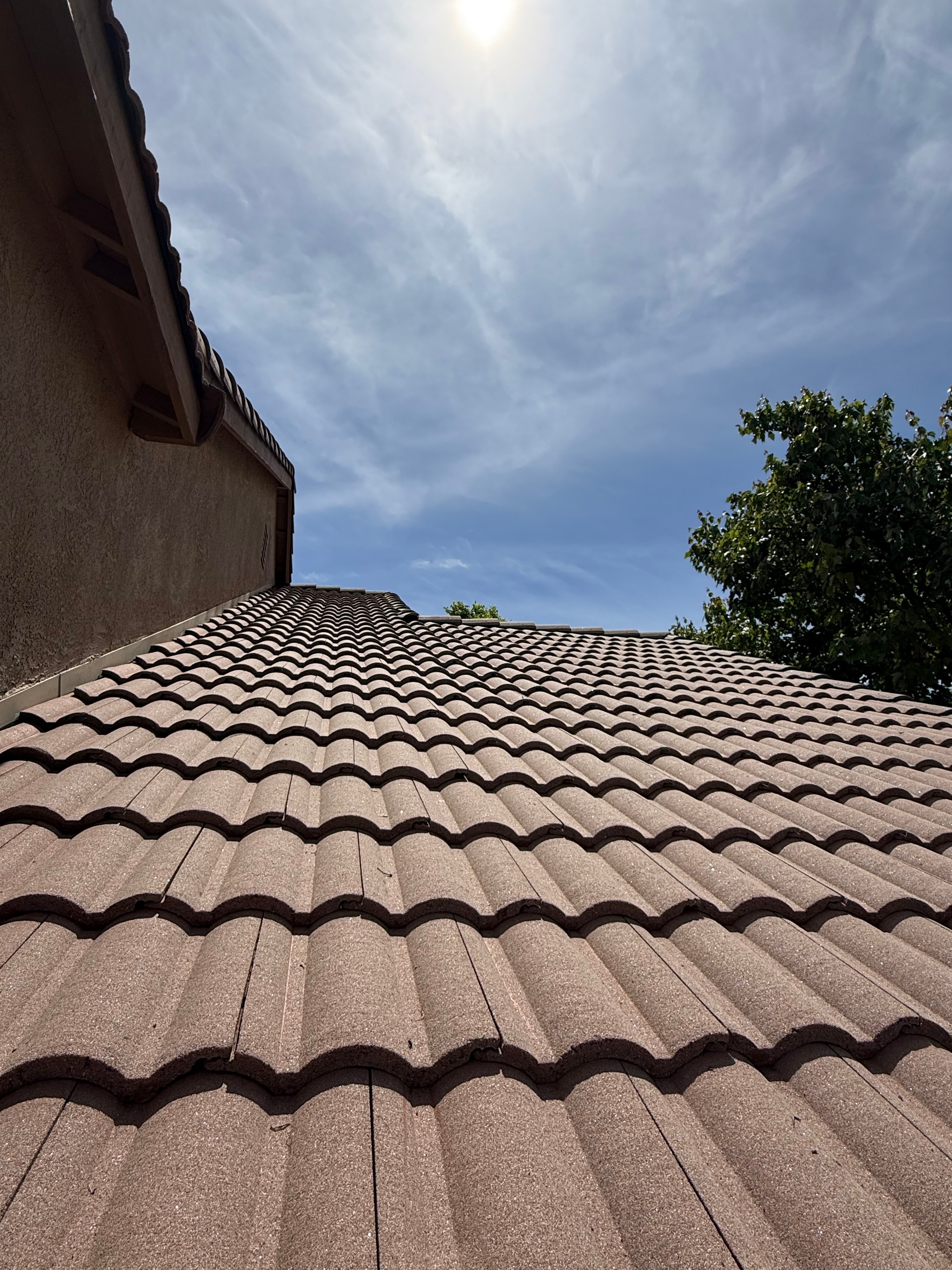 Clean residential tile roof and exterior wall